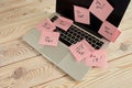 Image of laptop full of sticky notes reminders on screen. Work overload concept image. Coworking or working at home concept image Royalty Free Stock Photo