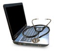 image of a laptop and stethoscope on a white background Royalty Free Stock Photo