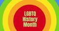 Image of lgbtq history month text on rainbow circles Royalty Free Stock Photo