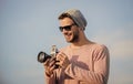 An image is Life. sexy man touristic reporter. photographer in glasses. travel with camera. male fashion style. looking Royalty Free Stock Photo
