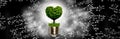 Image with a light bulb inside which a tree is symbolically placed, and the crown of the tree looking like a heart Royalty Free Stock Photo