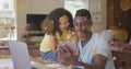 Image of light and dots moving over happy african american father and daughter using tablet Royalty Free Stock Photo