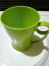 image of a light green drinking water glass in the kitchen