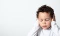 Little boy covering his ears Royalty Free Stock Photo