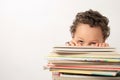 Little boy with a pile of books Royalty Free Stock Photo