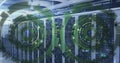 Image of loading circles over binary codes on data server racks in server room Royalty Free Stock Photo