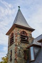 Looking up at stone steeple on Christian Church detail of top Royalty Free Stock Photo