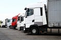 Lorries parked up outside a company`s car parking area Royalty Free Stock Photo