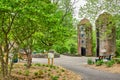 Lush green forest surrounding two silos at Bernheim Forest with rainbow and plain park benches Royalty Free Stock Photo