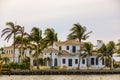 Far shot of a luxury mansion under construction with palm trees Royalty Free Stock Photo