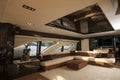 Image of luxury ship interior, comfortable sailboat cabin, expensive wooden design and soft white sofa inside on the yacht