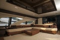 Image of luxury ship interior, comfortable sailboat cabin, expensive wooden design and soft white sofa inside on the yacht