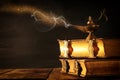 Image of magical aladdin lamp with glitter smoke. Lamp of wishes. Royalty Free Stock Photo