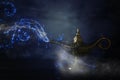 Image of magical mysterious aladdin lamp with glitter sparkle smoke over black background. Lamp of wishes. Royalty Free Stock Photo