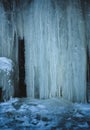 an icy waterfall with icicles of ice hanging down from it