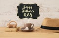 Image of male fedora hat, cup of hot coffee or tea and car toy o Royalty Free Stock Photo