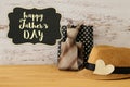 Image of male fedora hat and male stuff over wooden table. Father`s day concept. Royalty Free Stock Photo