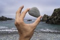 Image of a male hand holding a stone. Royalty Free Stock Photo