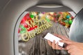 image of male hand using phone on the plane and Christmas ornaments Royalty Free Stock Photo