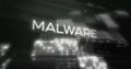 Image of malware text and digital data processing over black background