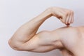 A man bicep on a white background
