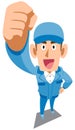 .A man in blue work clothes holding a fist