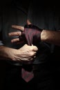 Image of man getting ready for office fight with a tie on his fist Royalty Free Stock Photo