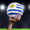 Man holding Soccer ball with Uruguayan flag Royalty Free Stock Photo