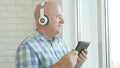 Image with a Man Listening Music with Bluetooth Headphones Royalty Free Stock Photo