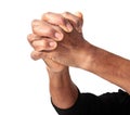 Man praying with arms outstretched and hands clenched together Royalty Free Stock Photo