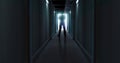 Image of man silhouette standing in dark corridor