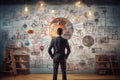 An image of a man standing in front of a wall covered in various drawings, head manager lead brainstorm ideas sharing standing Royalty Free Stock Photo