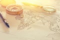 Image of map, magnifying glass and old compass. selective focus Royalty Free Stock Photo