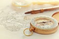 Image of map, magnifying glass and old compass. selective focus Royalty Free Stock Photo