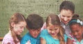 Image of math formulas over diverse pupils at school Royalty Free Stock Photo