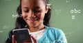 Image of mathematical equations over biracial girl using smartphone Royalty Free Stock Photo