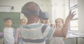 Image of mathematical equations over schoolchildren using vr headsets