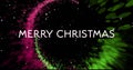 Image of merry christmas text and circle of light trail on black background Royalty Free Stock Photo