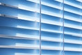 Metal blue horizontal blinds close up close the window from daylight in room Royalty Free Stock Photo