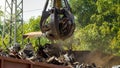 Photo of metal scrapyard with working heavy machines Royalty Free Stock Photo