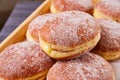 Mexican baked goods pastry donut red jelly strawberry filled oozing outside in pile of sugary sweets