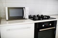 Modern kitchen interior with electric and microwave oven. Royalty Free Stock Photo