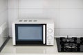 Modern kitchen interior with electric and microwave oven. Royalty Free Stock Photo