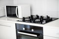 Modern kitchen interior with electric and microwave oven. Royalty Free Stock Photo