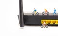 image of mini figure dolls riding bike and running on wifi route Royalty Free Stock Photo