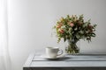 Image Minimalist elegance white cup on table against white backdrop