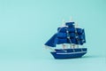 Image of a model sailboat on a light blue background Royalty Free Stock Photo
