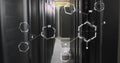 Image of molecule structures against server room in background Royalty Free Stock Photo