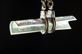 Image of money handcuffs dark background