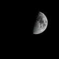 image of the moon craters and surface on a clear night sky